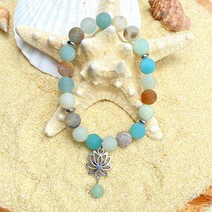 Beaded bracelet-Amazonite beads with silver tone accent beads and lotus charm
